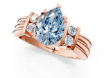 Three-Stone Fancy Blue Pear Cut Diamond Channel Set Ring in Rose gold with Bar Prongs_1