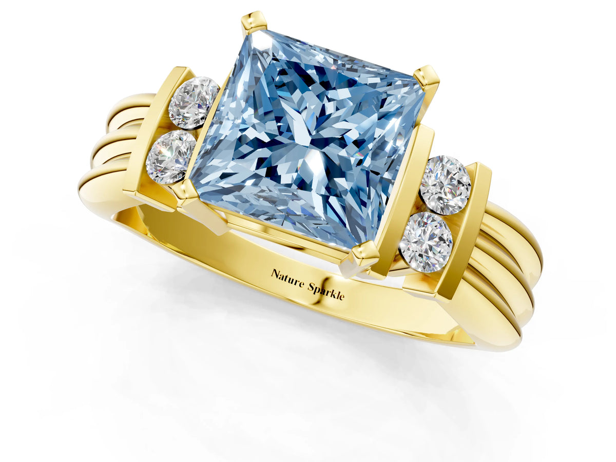 Three-Stone Fancy Blue Princess Cut Diamond Channel Set Ring in Yellow gold with Bar Prongs_1