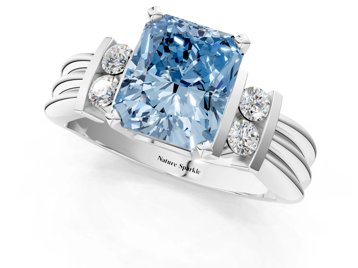 Three-Stone Fancy Blue Radiant Cut Diamond Channel Set Ring in White gold with Bar Prongs_1