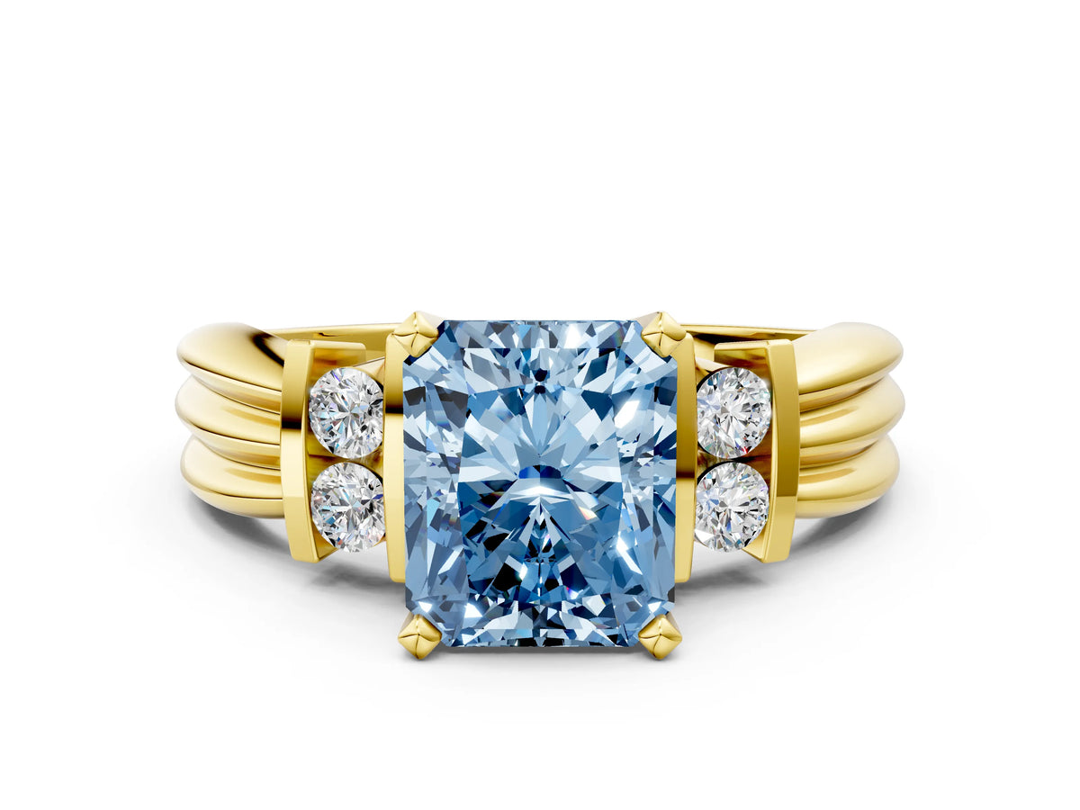 Three-Stone Fancy Blue Radiant Cut Diamond Channel Set Ring in Yellow gold with Bar Prongs
