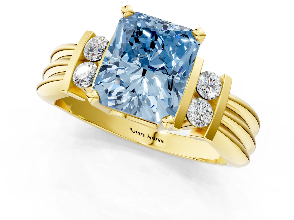Three-Stone Fancy Blue Radiant Cut Diamond Channel Set Ring in Yellow gold with Bar Prongs_1