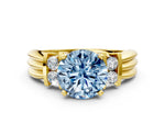 Three-Stone Fancy Blue Round Cut Diamond Channel Set Ring in Yellow gold with Bar Prongs