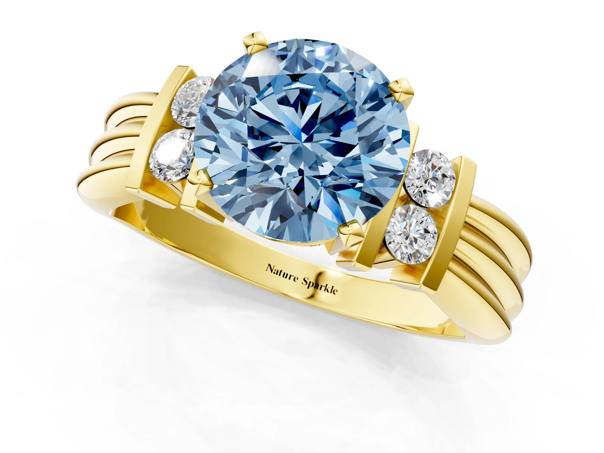 Three-Stone Fancy Blue Round Cut Diamond Channel Set Ring in Yellow gold with Bar Prongs_1