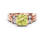 Three-Stone Fancy Yellow Cushion Cut Diamond Channel Set Ring in Rose gold with Bar Prongs