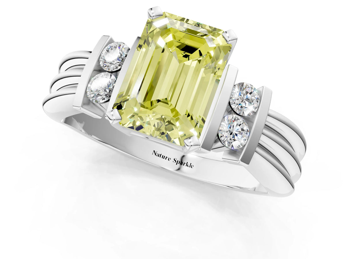Three-Stone Fancy Yellow Emerald Cut Diamond Channel Set Ring in White gold with Bar Prongs_1