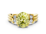 Three-Stone Fancy Yellow Oval Cut Diamond Channel Set Ring in Yellow gold with Bar Prongs