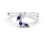 Three-Stone Round Tanzanite Leaf Bypass Ring in White gold with Bezel Setting