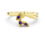 Three-Stone Round Tanzanite Leaf Bypass Ring in Yellow gold with Bezel Setting