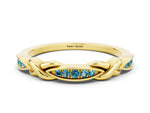 Twisted Marquise Blue Topaz Pavé Band in Yellow gold with Shared Prong Setting