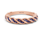 Twisted Pavé Round Blue Sapphire Eternity Band in Rose gold with Shared Prong Setting