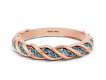 Twisted Pavé Round Blue Topaz Eternity Band in Rose gold with Shared Prong Setting