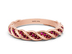 Twisted Pavé Round Garnet Eternity Band in Rose gold with Shared Prong Setting