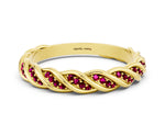 Twisted Pavé Round Garnet Eternity Band in Yellow gold with Shared Prong Setting
