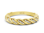 Twisted Pavé Round Moissanite Eternity Band in Yellow gold with Shared Prong Setting