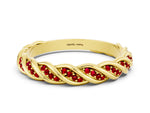 Twisted Pavé Round Ruby Eternity Band in Yellow gold with Shared Prong Setting