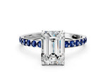 White gold Emerald Cut Diamond Solitaire Ring with Round Blue Sapphire Pavé Band and Prong Setting
