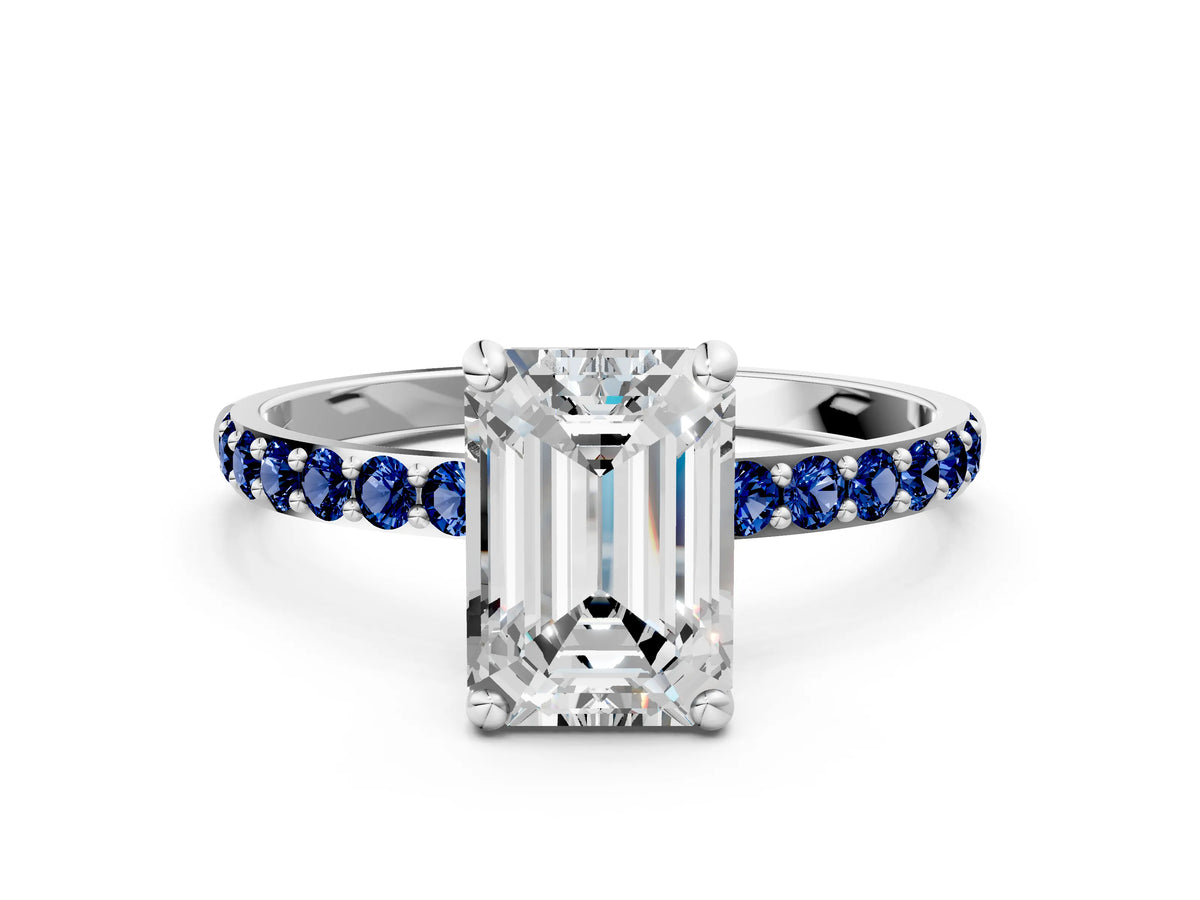 White gold Emerald Cut Diamond Solitaire Ring with Round Blue Sapphire Pavé Band and Prong Setting