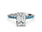 White gold Emerald Cut Diamond Solitaire Ring with Round Blue Topaz Pavé Band and Prong Setting