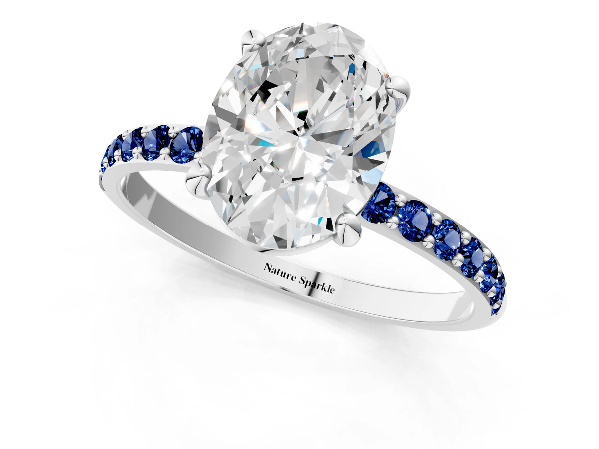 White gold Oval Cut Diamond Solitaire Ring with Round Blue Sapphire Pavé Band and Prong Setting_1