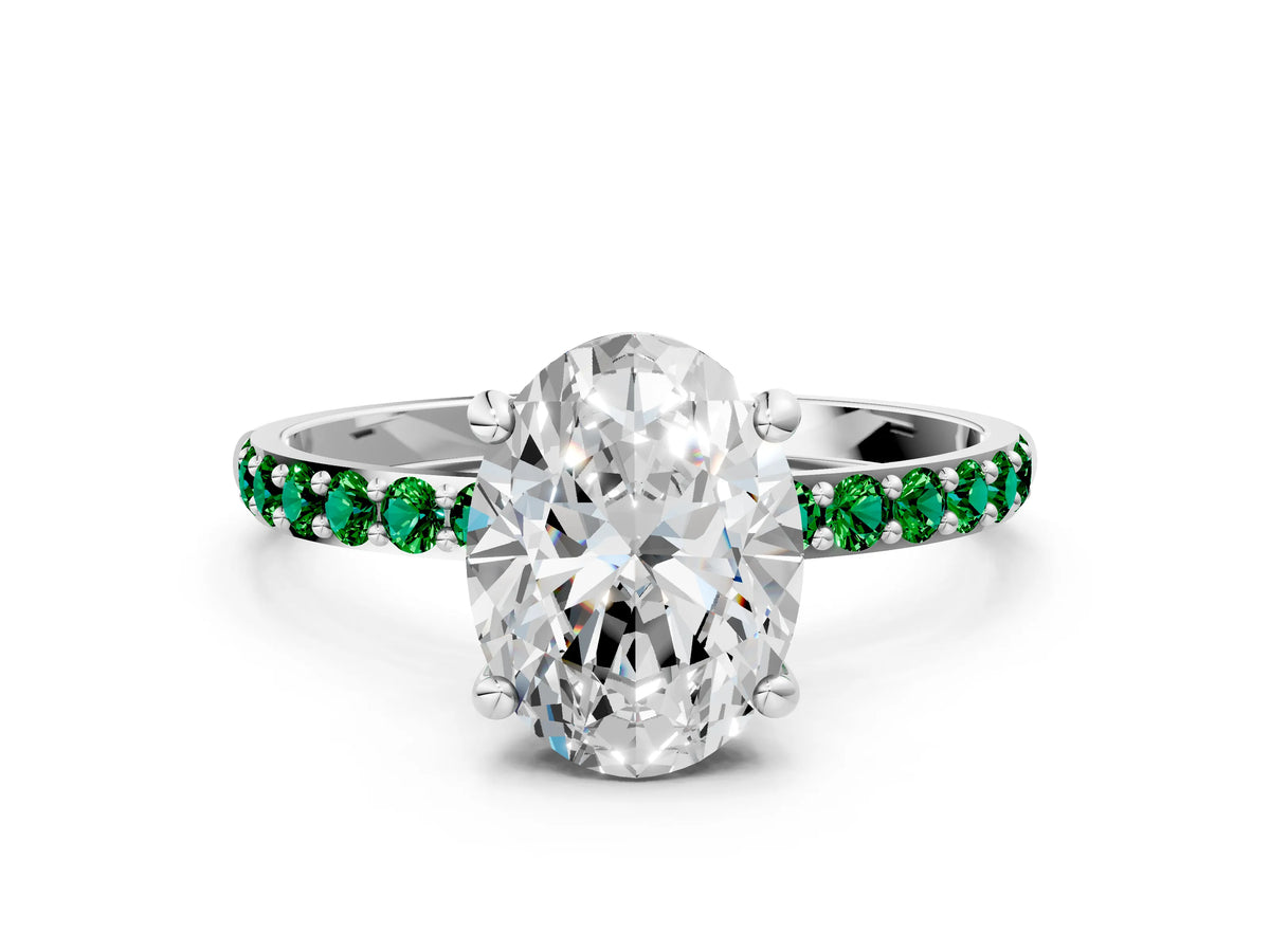 White gold Oval Cut Diamond Solitaire Ring with Round Emerald Pavé Band and Prong Setting