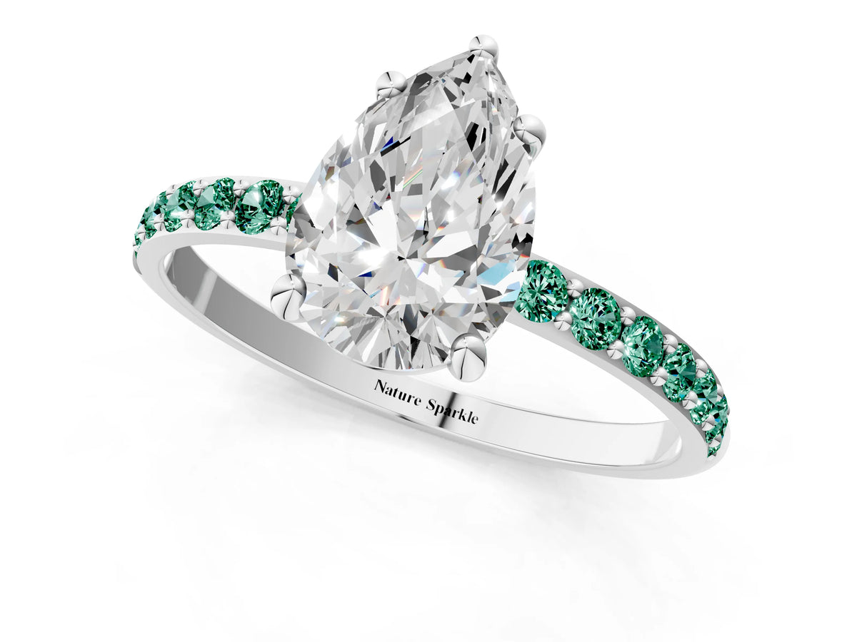 White gold Pear Cut Diamond Solitaire Ring with Round Green Sapphire Pavé Band and Prong Setting_1