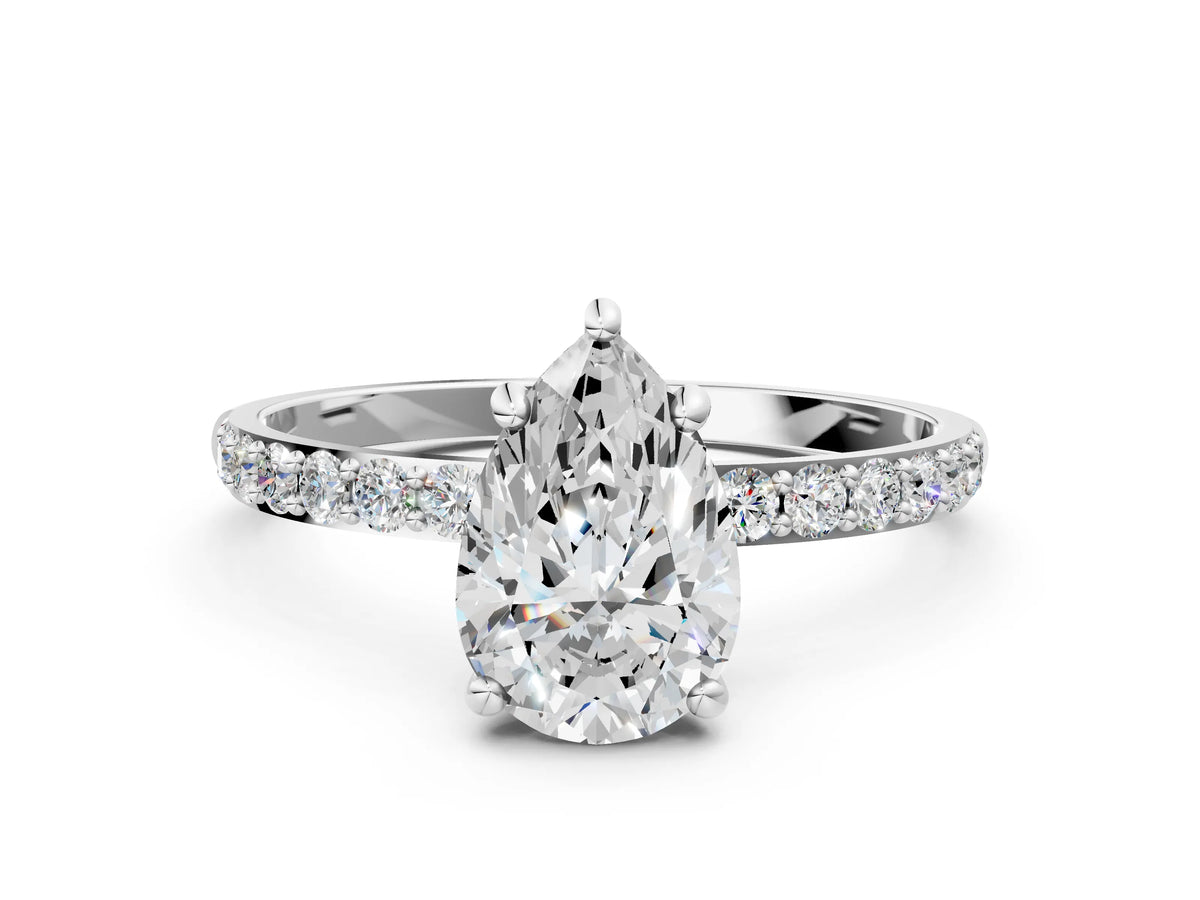 White gold Pear Cut Diamond Solitaire Ring with Round Moissanite Pavé Band and Prong Setting