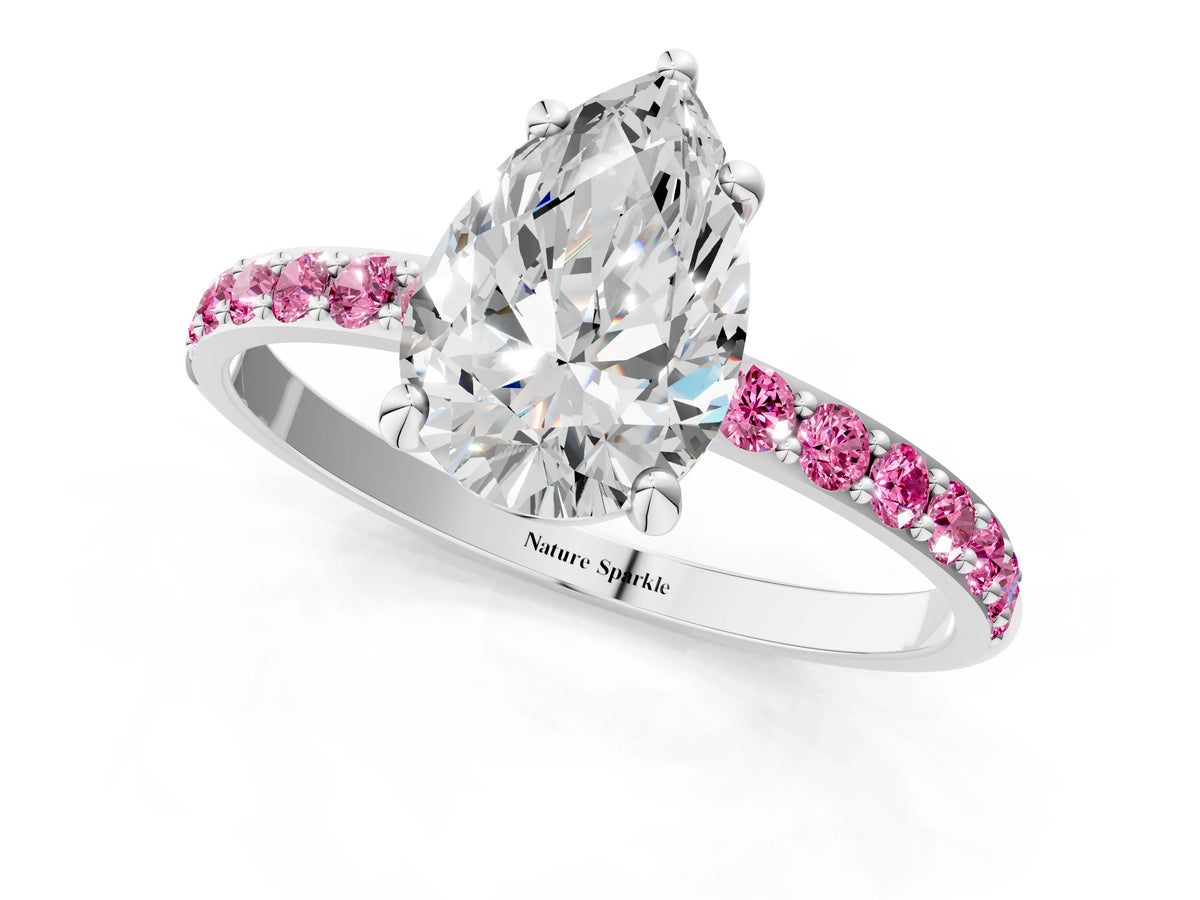 White gold Pear Cut Diamond Solitaire Ring with Round Pink Sapphire Pavé Band and Prong Setting_1