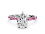 White gold Pear Cut Diamond Solitaire Ring with Round Pink Sapphire Pavé Band and Prong Setting