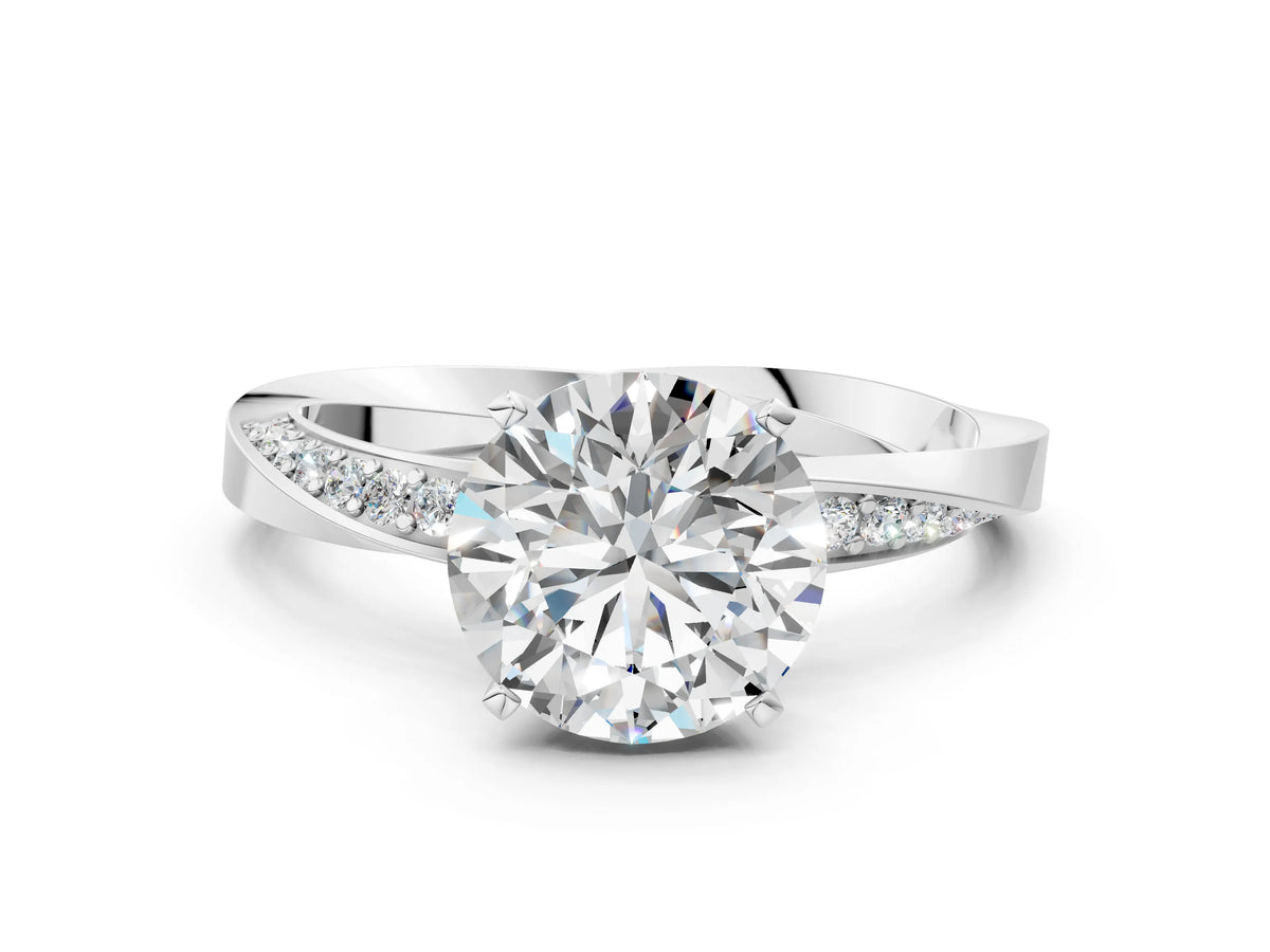 White gold Round Cut Diamond Engagement Ring with Side Stone Accents and Four-Prong Setting