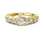 Yellow gold Bezel Set Oval Diamond Half Eternity Band