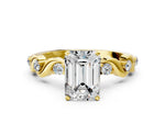 Yellow gold Emerald Cut Diamond Solitaire Twisted Band with Round Accents and Prong Setting