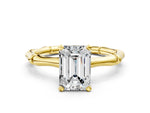 Yellow gold Emerald Cut Solitaire Diamond Ring with Bamboo Band and Four-Prong Setting