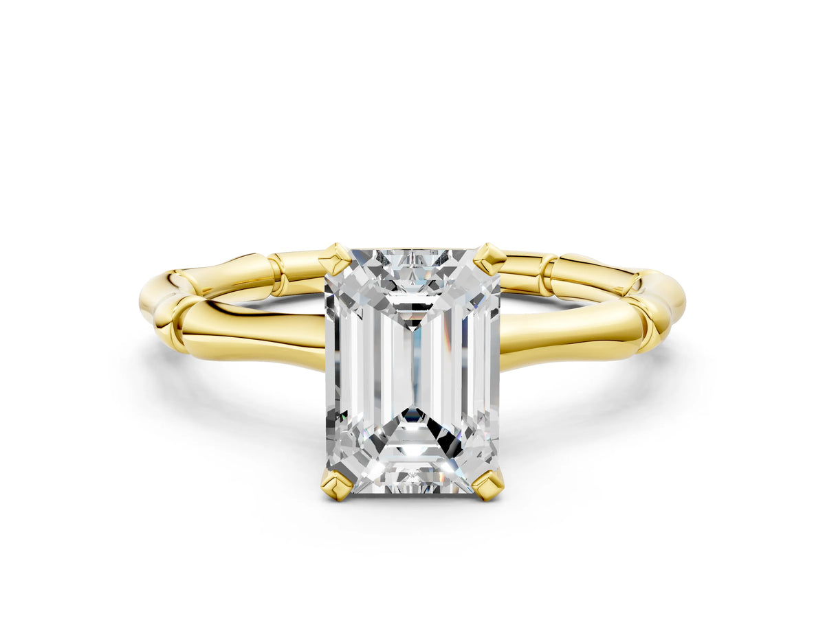 Yellow gold Emerald Cut Solitaire Diamond Ring with Bamboo Band and Four-Prong Setting