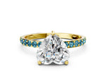 Yellow gold Heart Cut Diamond Solitaire Ring with Round Blue Topaz Pavé Band and Prong Setting
