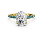 Yellow gold Oval Cut Diamond Solitaire Ring with Round Blue Topaz Pavé Band and Prong Setting