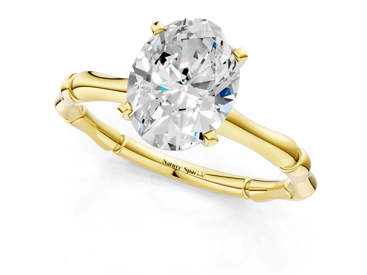 Yellow gold Oval Cut Solitaire Diamond Ring with Bamboo Band and Four-Prong Setting_1