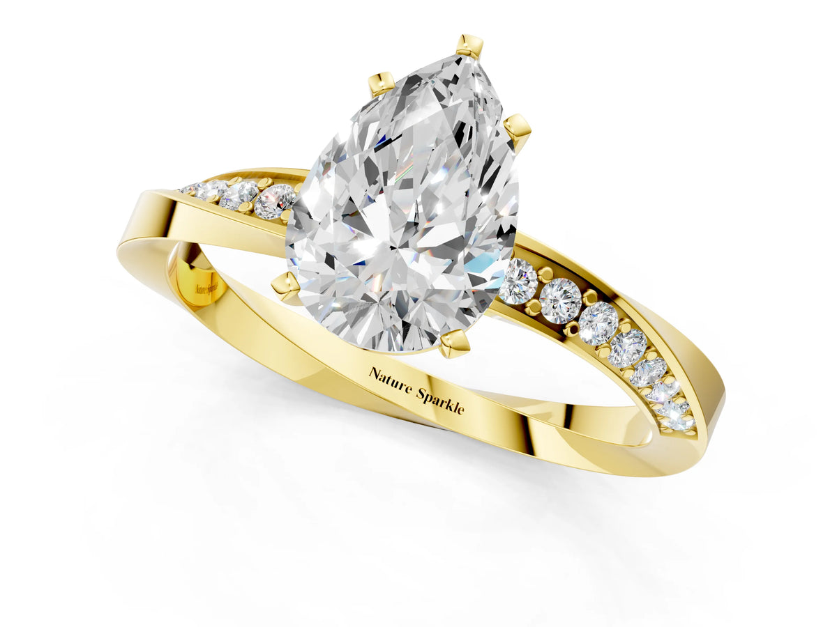 Yellow gold Pear Cut Diamond Engagement Ring with Side Stone Accents and Four-Prong Setting_1