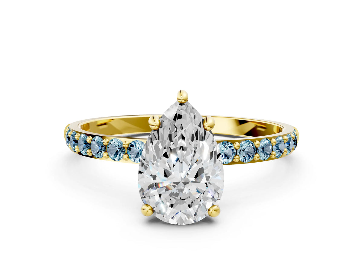 Yellow gold Pear Cut Diamond Solitaire Ring with Round Aquamarine Pavé Band and Prong Setting
