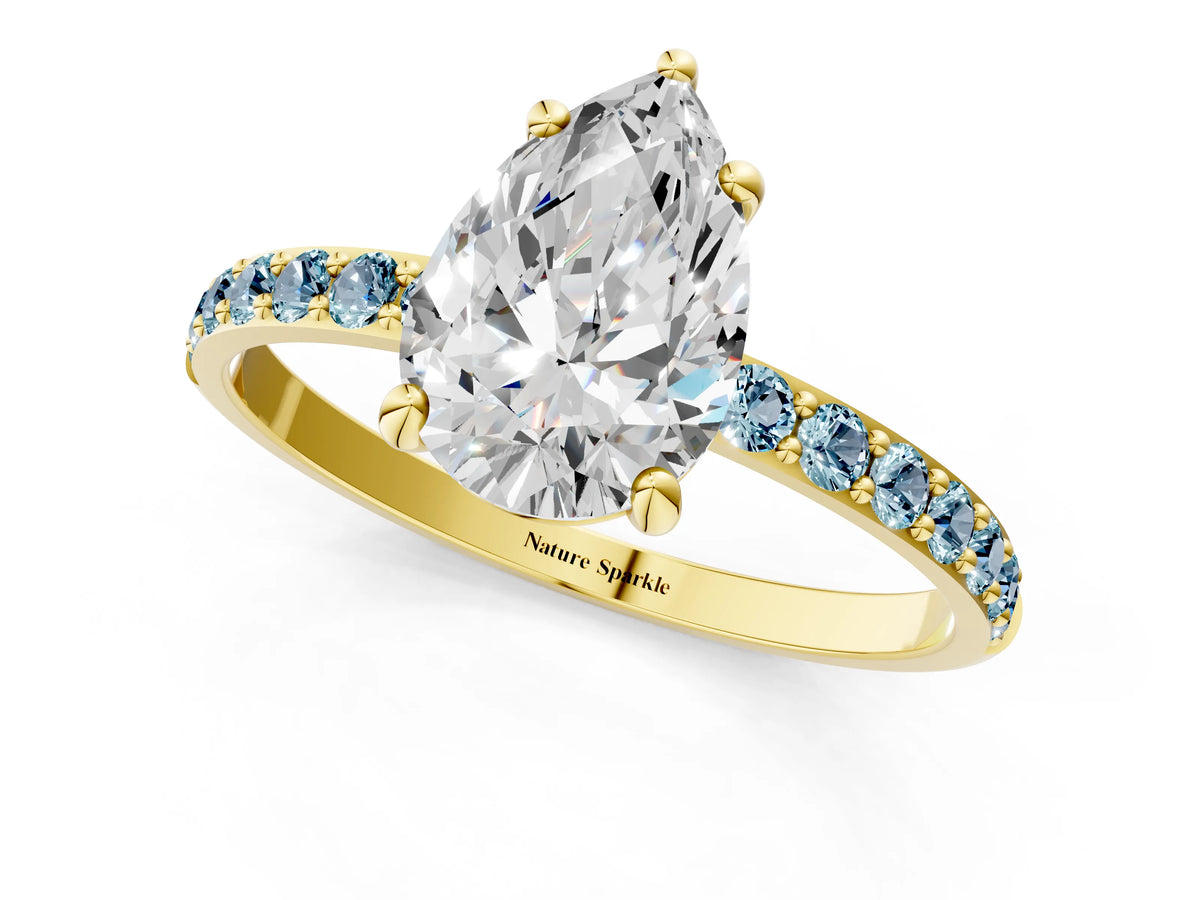 Yellow gold Pear Cut Diamond Solitaire Ring with Round Aquamarine Pavé Band and Prong Setting_1