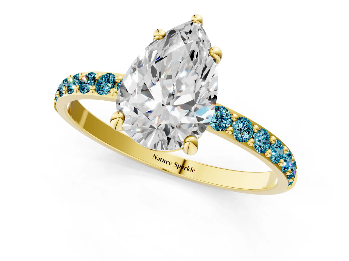Yellow gold Pear Cut Diamond Solitaire Ring with Round Blue Topaz Pavé Band and Prong Setting_1