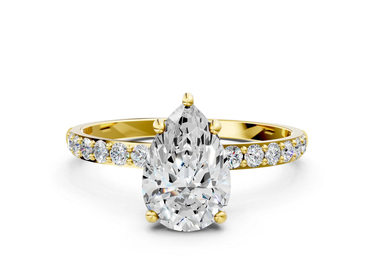Yellow gold Pear Cut Diamond Solitaire Ring with Round Moissanite Pavé Band and Prong Setting