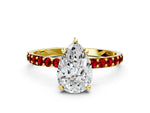 Yellow gold Pear Cut Diamond Solitaire Ring with Round Ruby Pavé Band and Prong Setting