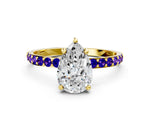 Yellow gold Pear Cut Diamond Solitaire Ring with Round Tanzanite Pavé Band and Prong Setting