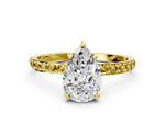 Yellow gold Pear Cut Diamond Solitaire Ring with Round Yellow Sapphire Pavé Band and Prong Setting