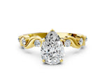 Yellow gold Pear Cut Diamond Solitaire Twisted Band with Round Accents and Prong Setting