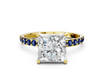 Yellow gold Princess Cut Diamond Solitaire Ring with Round Blue Sapphire Pavé Band and Prong Setting