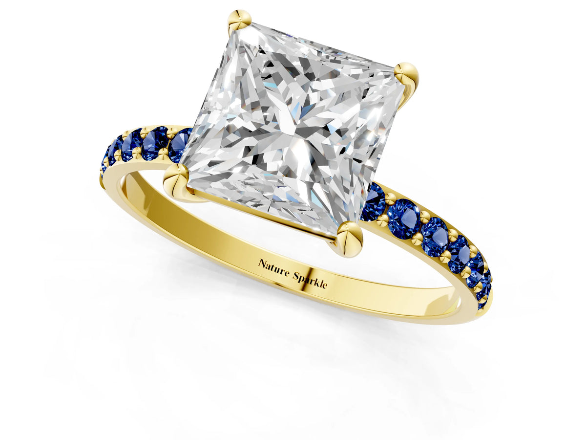 Yellow gold Princess Cut Diamond Solitaire Ring with Round Blue Sapphire Pavé Band and Prong Setting_1