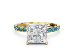 Yellow gold Princess Cut Diamond Solitaire Ring with Round Blue Topaz Pavé Band and Prong Setting