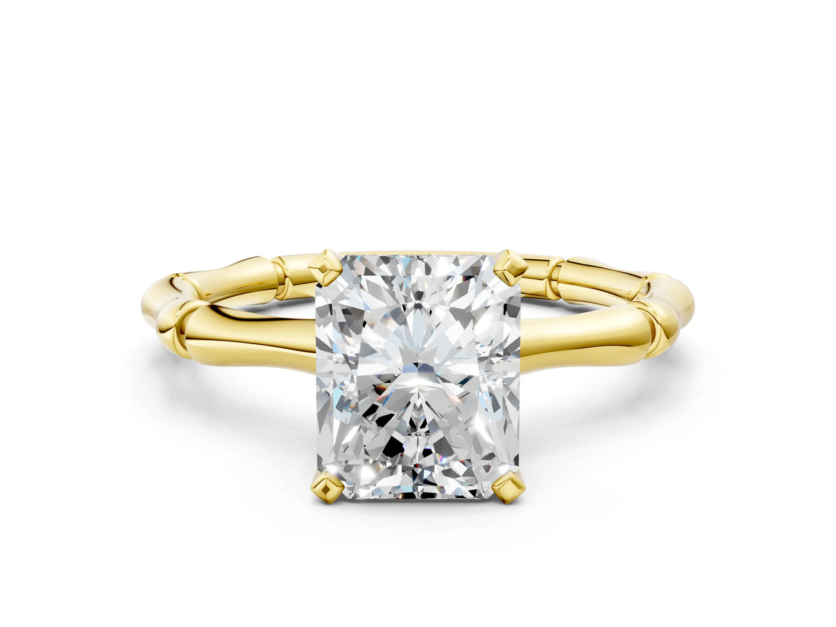 Yellow gold Radiant Cut Solitaire Diamond Ring with Bamboo Band and Four-Prong Setting