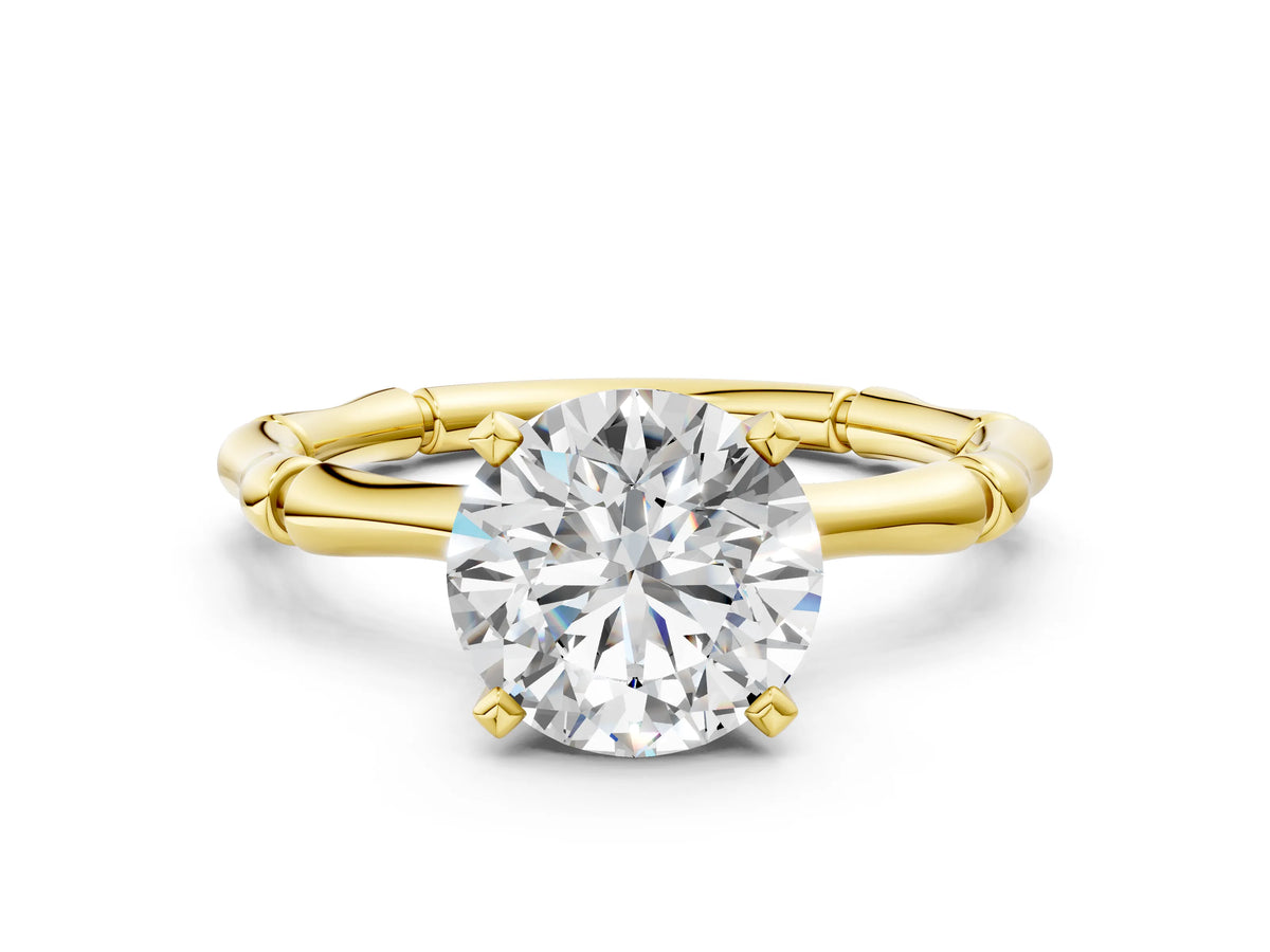 Yellow gold Round Cut Solitaire Diamond Ring with Bamboo Band and Four-Prong Setting